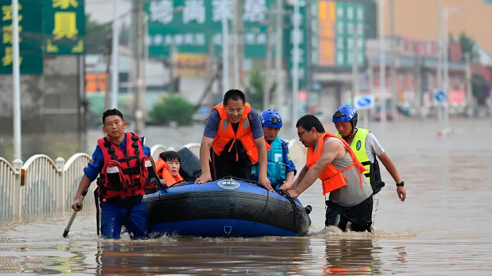 China's capital Beijing has been battered by the heaviest rainfall in 140 years